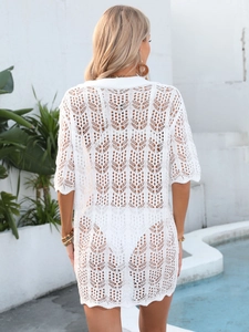Back view of a white crochet beach cover-up with heart hollow patterns for women