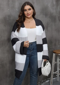 Detail of soft striped knit cardigan with color-block texture and ribbed cuffs