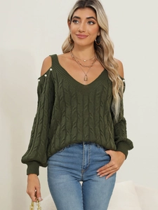 Detail of dark green V-neck knit sweater featuring cold-shoulder cutouts and pearl accents