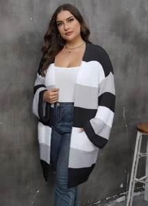 Close-up of the striped knit cardigan showing the textured brushed fabric and open pocket