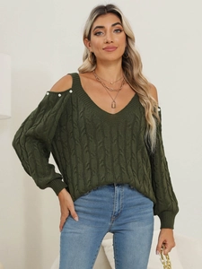 Detailed view of dark green cable knit sweater with v-neck and cold shoulder pearl accents