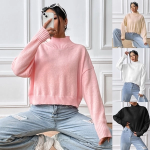 Detail of soft knit texture on high-neck drop shoulder sweater for women in multi colors