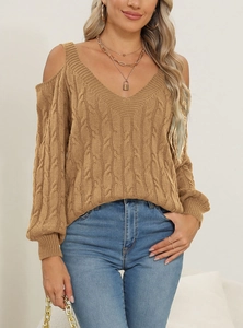 Detail of V-neck off-shoulder knitted sweater with cable pattern in camel brown