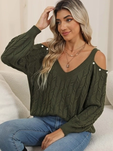 Detail of dark green cable knit sweater with V-neck and cold-shoulder pearl accents