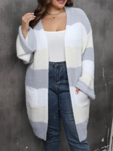 Detail of plush striped cardigan showing soft faux mink texture and grey color block weave