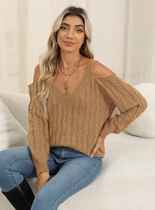 Macro view of khaki cable knit sweater showing deep V-neck and cold shoulder texture