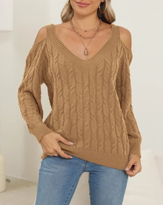 Detail of a brown knit sweater showing the cable texture and off-shoulder design