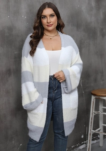 Detail of soft striped plush cardigan showing the gray and white knit texture and deep pocket