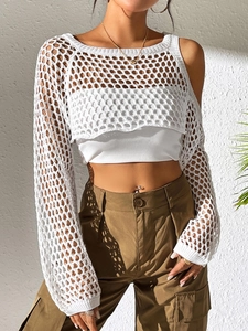 Detailed macro of white crochet long sleeve crop top with mesh knit pattern and rib tube top
