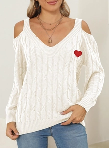 Detail of white cable knit sweater featuring deep V-neck, cold shoulder and red heart patch