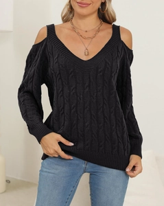 Detail of black cable-knit sweater featuring sexy deep V-neck and cold-shoulder design