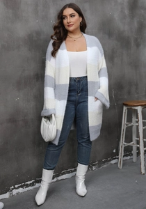 Detail of soft striped cardigan showing grey white and beige plush faux mink texture