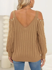 Detail of cable knit sweater back with deep V-neck, cold-shoulder and pearl accents