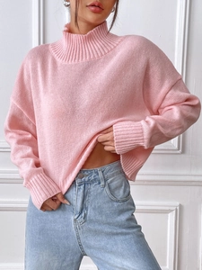 Women's pink high neck knit sweater with drop shoulders and ribbed cuffs for casual wear