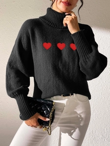 Women's black turtleneck knit sweater with red heart embroidery on the chest