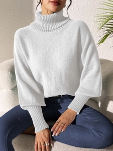Detail of white turtleneck sweater with ribbed cuffs and fine knit texture for women