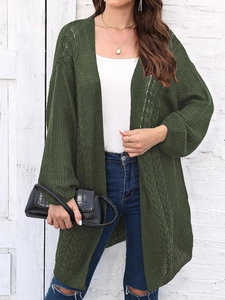 Detailed knit texture of a dark green open-front long cardigan with hollow out crochet design