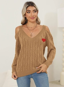 Detail of a brown chunky knit sweater with off-the-shoulder V-neck and red heart patch