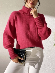 Women's rose pink oversized turtleneck knit sweater with ribbed cuffs and loose fit