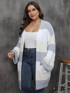 Detail of fuzzy striped knit cardigan showing the soft grey and beige mohair-like texture