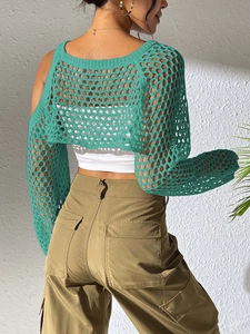 Detailed back view of green crochet hollow knit crop top with loose mesh texture