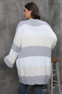 Rear view of striped oversized cardigan showing textured grey and beige knit fabric
