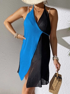 Detail of color-block knit beach cover-up with tie-side and asymmetric crochet texture