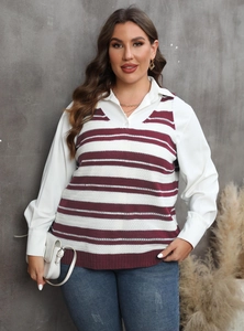 Detail view of a V-neck striped knit vest layered over a white collared shirt