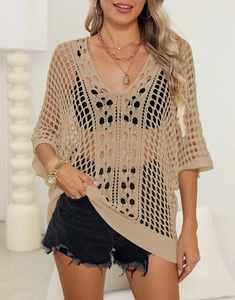 Detailed close-up of apricot crochet knit cover-up with hollow geometric mesh patterns