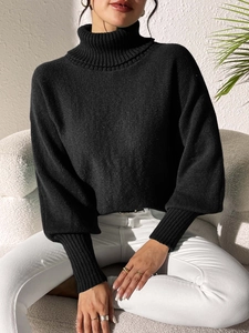 Chic black turtleneck knit sweater for women featuring stylish puff sleeves and ribbed cuffs