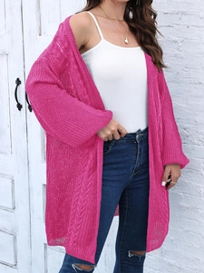 Close-up of fuchsia cable knit cardigan featuring hollow texture and casual long sleeves