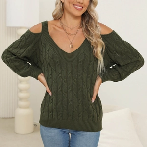 Detail of dark green cable-knit texture and stylish cold-shoulder design on V-neck sweater