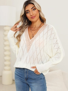 Detail of V-neck knitted sweater with pink lace trim and hollow out crochet texture
