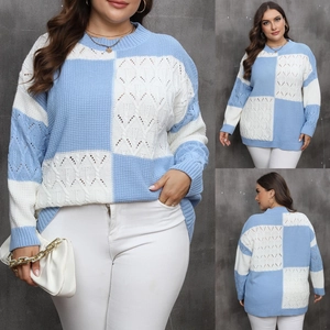 Detailed macro view of blue and white checkered knit sweater with textured diamond stitching