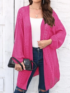 Detail of fuchsia hollow-out crochet knit cardigan with intricate cable knit texture