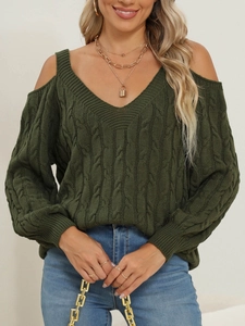 Detail showing the thick olive green cable-knit texture and deep V-neckline of the sweater