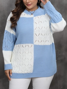 Detail of blue and white color-block knit sweater with diamond hollow out texture