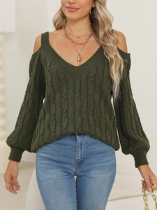 Detail of dark green cable knit sweater featuring a sexy V-neck and cold shoulder design
