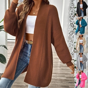 Detail showing various colors of long chunky knit cardigan with lantern sleeves