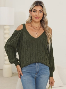Detail of dark green cable knit sweater with V-neck and stylish cold shoulder cutouts