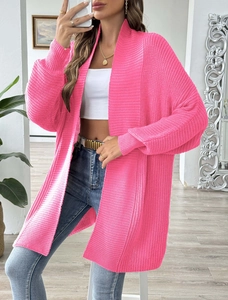 Detail showing fuchsia long sleeve oversized knit cardigan with ribbed texture and drop shoulders