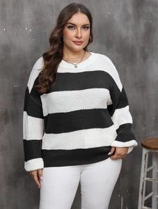 Detail of classic black and white striped knit sweater with round neck and drop shoulders