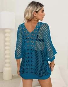 Detail of navy blue open knit crochet cover-up showing V-neck back design and mesh texture