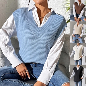 Detail showing various colors of women's V-neck knit vest including blue, brown, and black