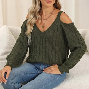 Close-up of forest green cable-knit sweater with cold shoulder design and deep V-neckline