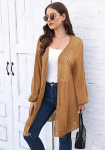 Detail of ginger open-knit cardigan featuring vertical stripes and hollow weave pattern