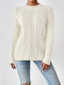 Close-up detail of cream white cable knit texture on women's round neck sweater