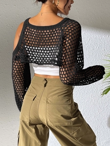 Rear view of black hollow crochet crop top featuring mesh knit and long sleeves