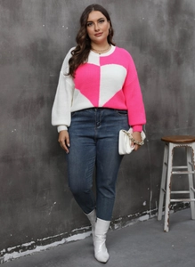 Full view of women's long sleeve knit sweater with heart patchwork and contrast colors