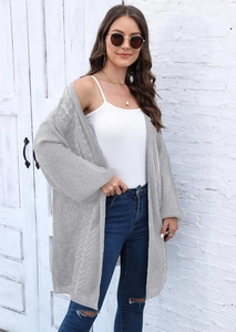 Detailed view of women's light grey cable knit cardigan with hollow weave texture